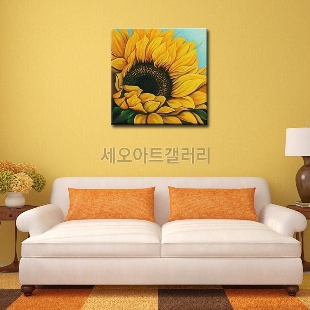 해바라기 그림 액자가 벽에 걸린 인테리어 모습을 촬영한 사진 2
